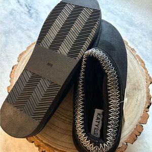 Katydid Black slip ons with White Stitch